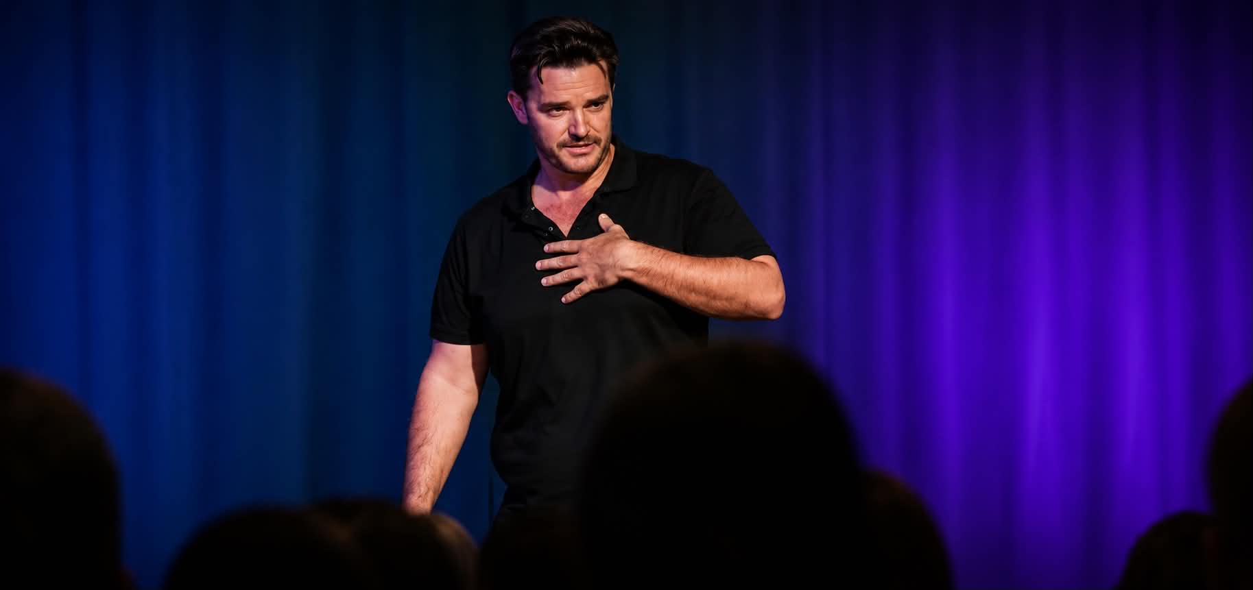 Mark Barnes speaking on stage